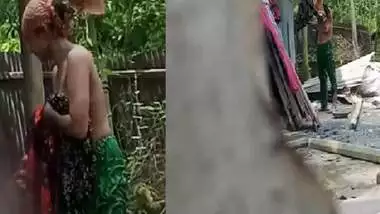 Village neighbor girl outdoor bath caught through hole